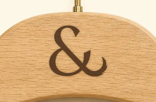 The ampersand burnt into a beech hanger